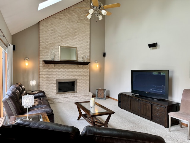 carpeted living room with a brick fireplace, high vaulted ceiling, and ceiling fan