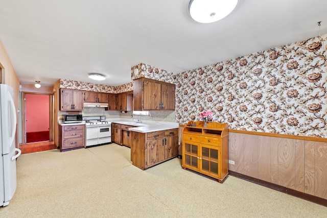 kitchen with white appliances and tasteful backsplash