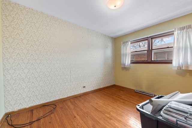 empty room with hardwood / wood-style flooring