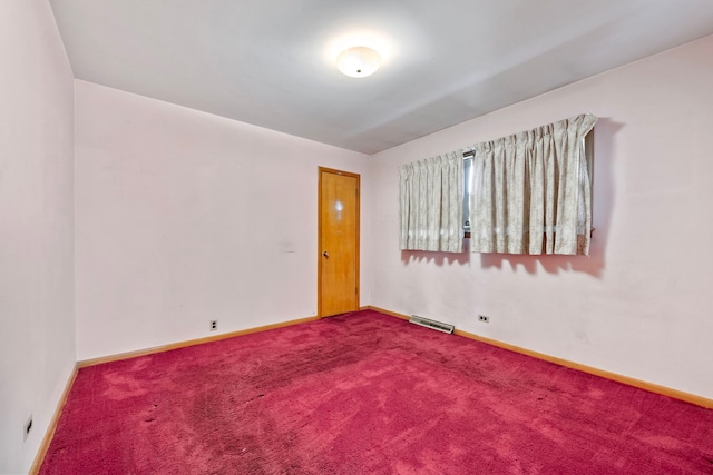 spare room featuring carpet flooring