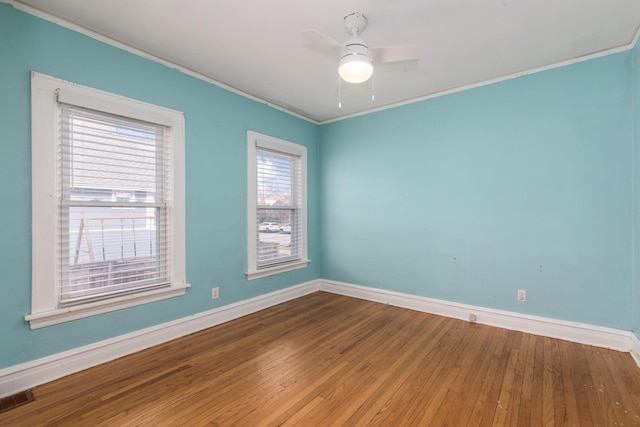 spare room with ceiling fan, hardwood / wood-style floors, and ornamental molding