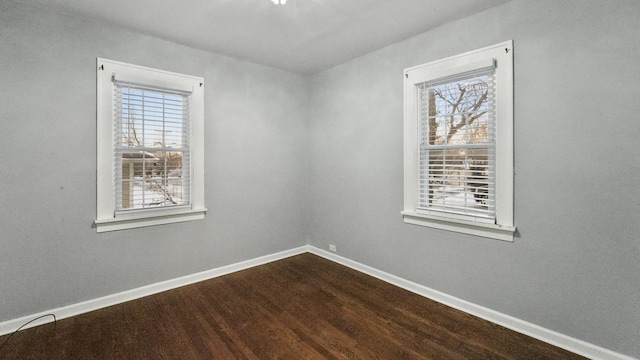 spare room featuring hardwood / wood-style floors