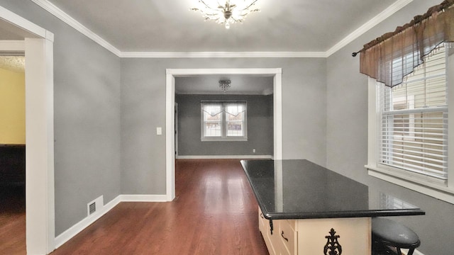 entrance foyer featuring dark hardwood / wood-style floors and ornamental molding