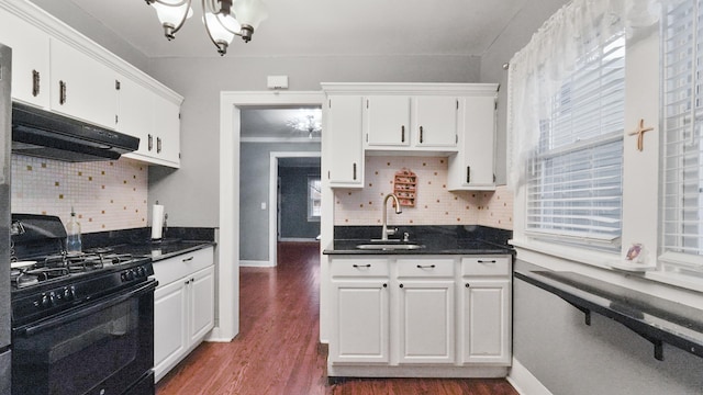 kitchen featuring sink, white cabinets, black gas range oven, and a notable chandelier