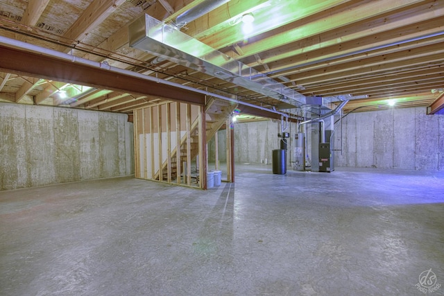 basement featuring heating unit and gas water heater