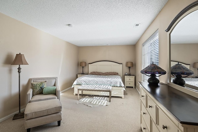 carpeted bedroom with a textured ceiling