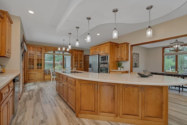 8726 E Goodfarm Rd, Gardner, IL 60424 - kitchen featuring stainless steel appliances, light wood-style flooring, light countertops, brown cabinetry, and recessed lighting