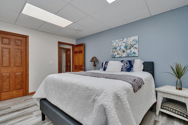 8726 E Goodfarm Rd, Gardner, IL 60424 - bedroom featuring light wood finished floors and a drop ceiling