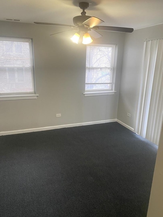 carpeted empty room with ceiling fan