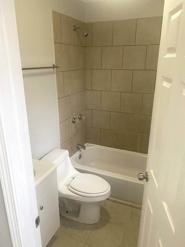 full bathroom featuring tile patterned floors, vanity, toilet, and tiled shower / bath