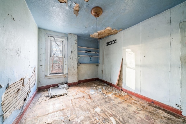 interior space with a textured ceiling