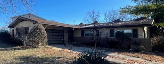 ranch-style house featuring a garage