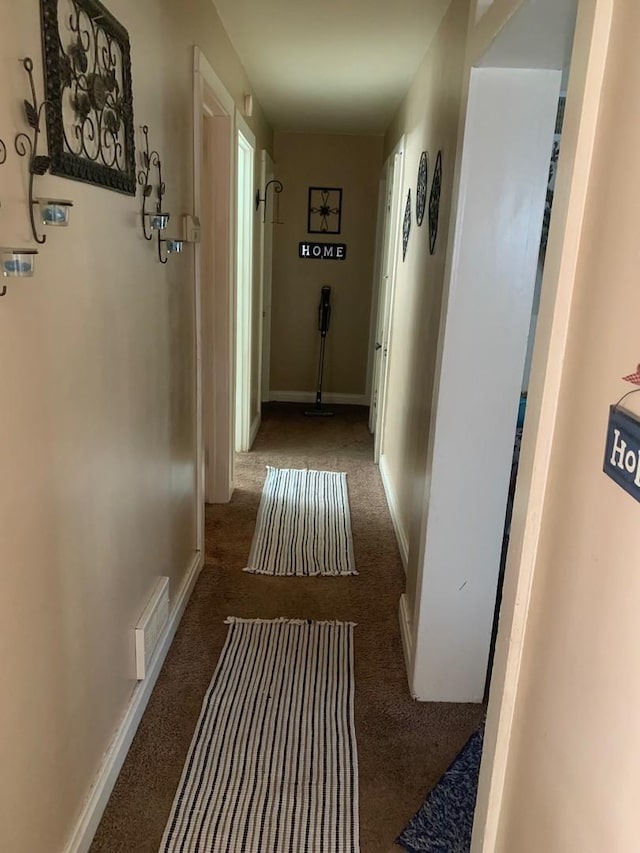 corridor with dark carpet