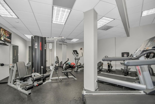 workout area featuring a paneled ceiling