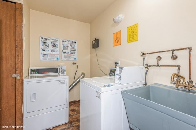 laundry room featuring sink and washer and clothes dryer