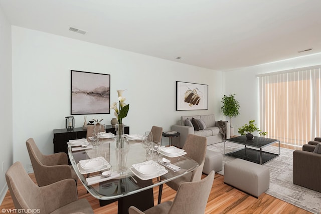 dining room with light hardwood / wood-style floors