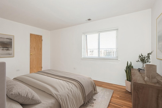 bedroom featuring light hardwood / wood-style floors