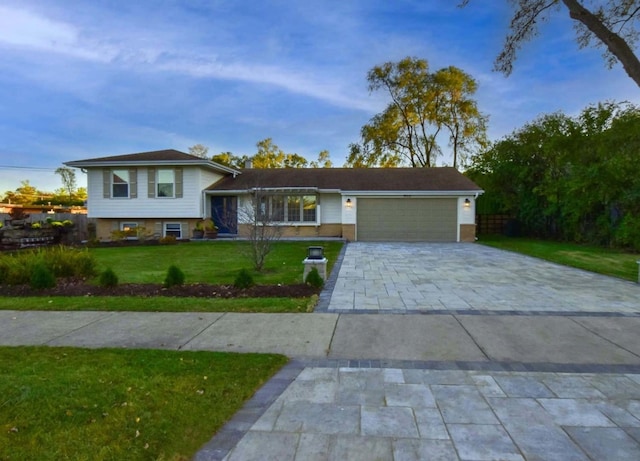 view of front of home with a garage and a front yard