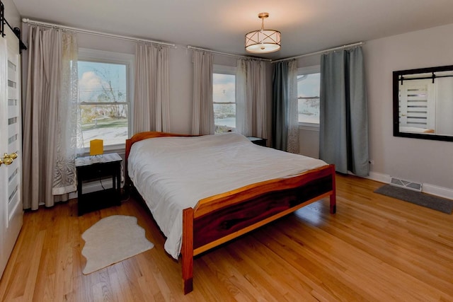 bedroom with wood-type flooring