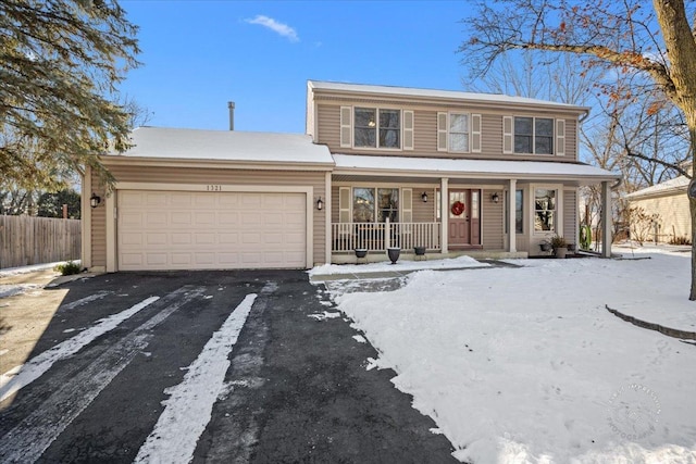 view of front of property with a garage and covered porch