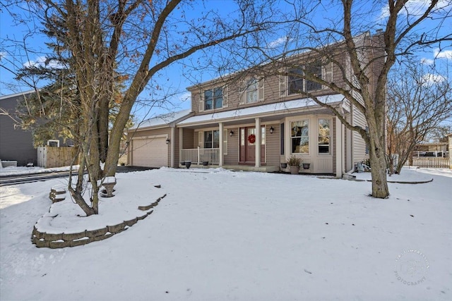 view of front facade with a garage and covered porch