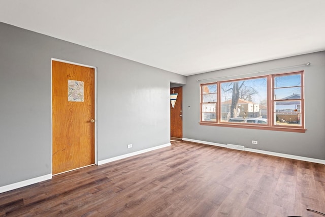 empty room featuring wood-type flooring