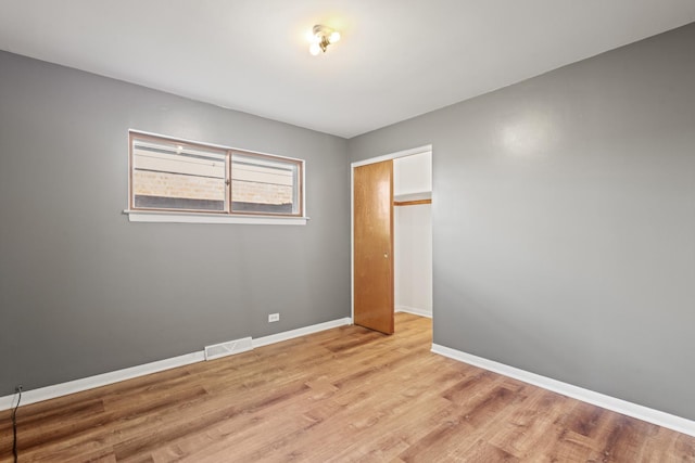 spare room featuring light hardwood / wood-style floors