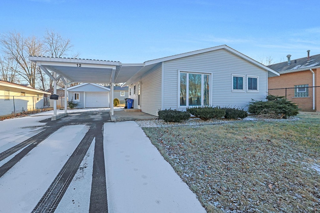 view of front of house with an outbuilding and a garage