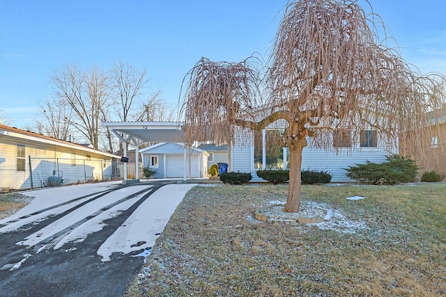 single story home featuring a carport