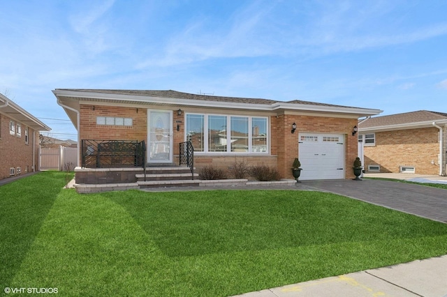 view of front of property featuring a garage and a front yard