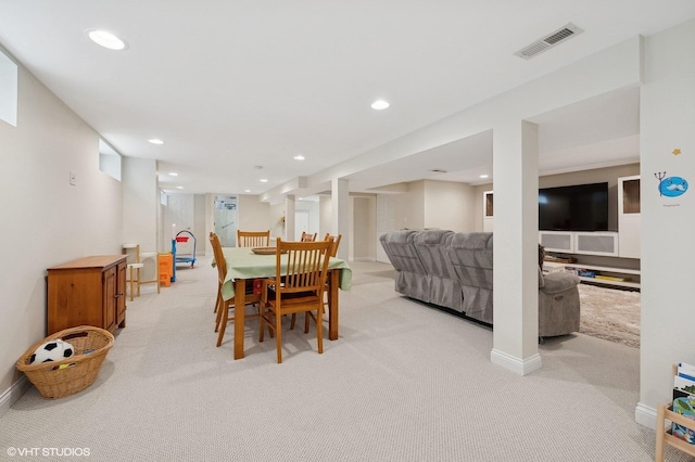 dining room with light colored carpet