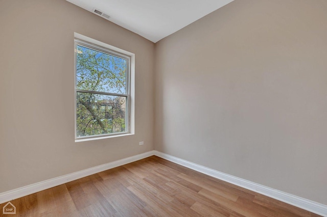 spare room featuring light wood-type flooring