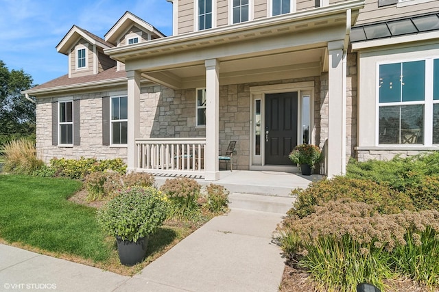 entrance to property featuring a porch