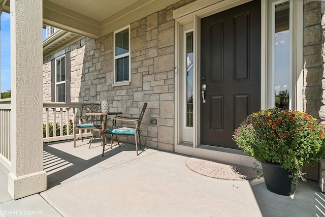 doorway to property featuring a porch