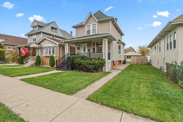 view of front facade with a front yard and covered porch