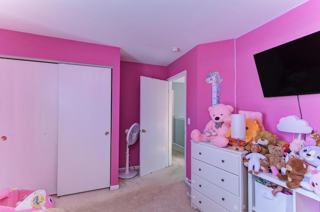 carpeted bedroom with a closet