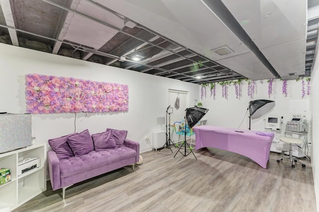 basement featuring hardwood / wood-style floors