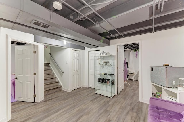 basement with wood-type flooring