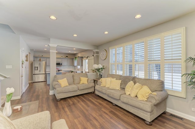 living room featuring dark hardwood / wood-style flooring