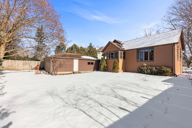 ranch-style home with an outbuilding