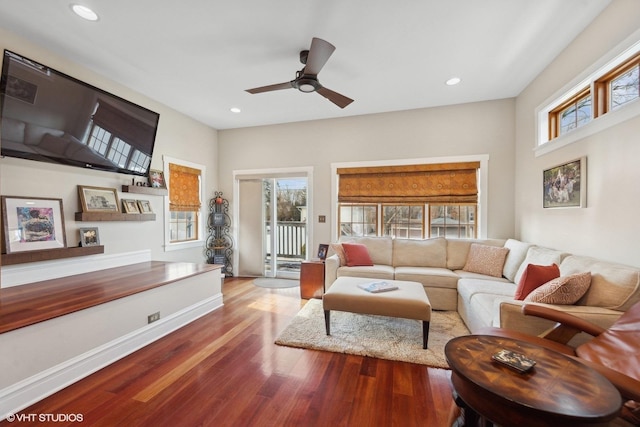 living room featuring ceiling fan and wood-type flooring