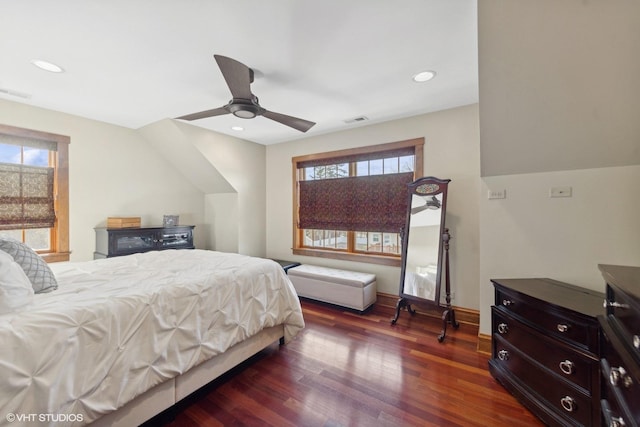 bedroom with ceiling fan and dark hardwood / wood-style flooring