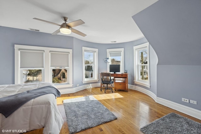 bedroom with lofted ceiling, light hardwood / wood-style floors, and ceiling fan