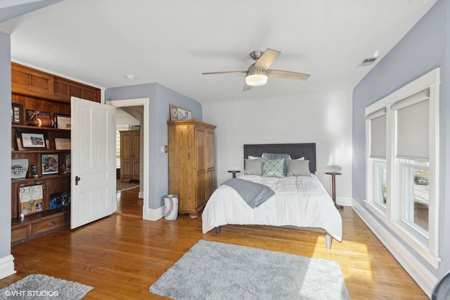 bedroom featuring hardwood / wood-style floors and ceiling fan