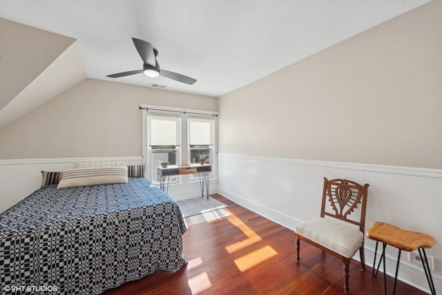 bedroom featuring lofted ceiling, dark wood-type flooring, and ceiling fan