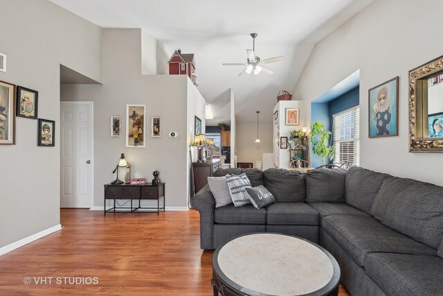 living room featuring hardwood / wood-style flooring and lofted ceiling