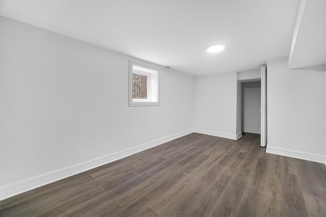 basement featuring dark hardwood / wood-style flooring