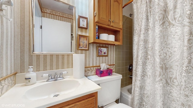 full bathroom with shower / bathtub combination with curtain, vanity, and toilet