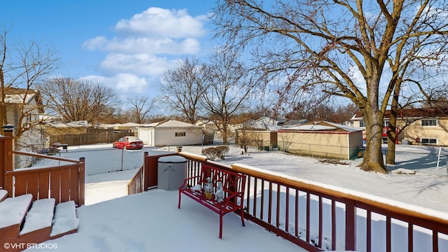 view of snow covered deck