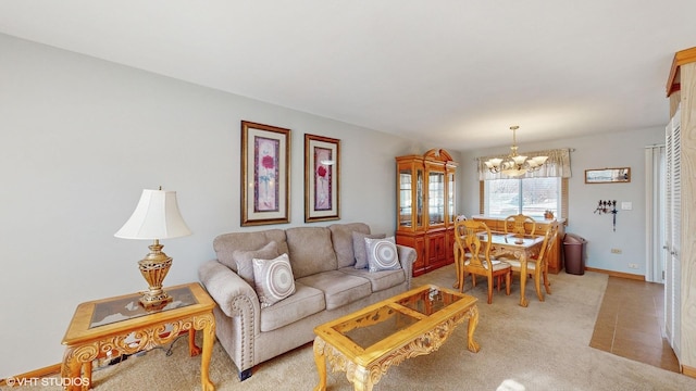 carpeted living room featuring a notable chandelier